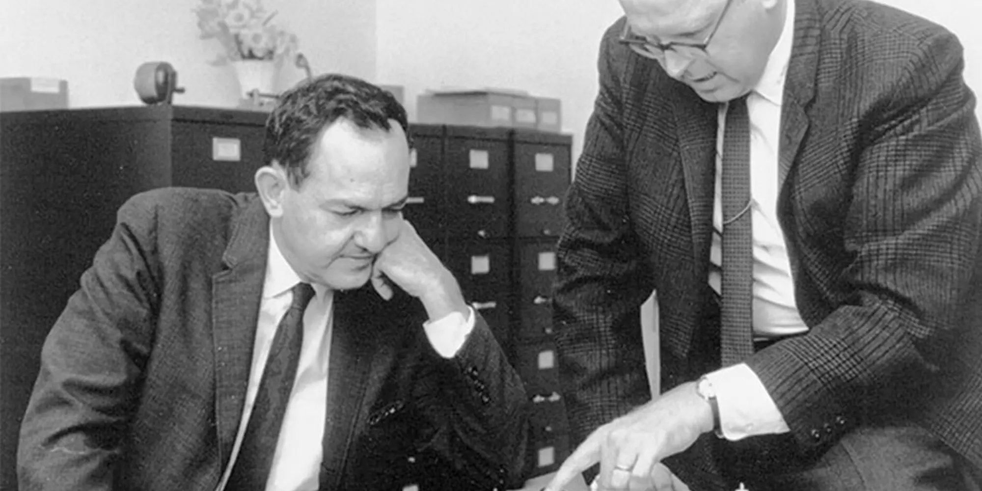 Carnegie Mellon University researchers Allen Newell and Herbert Simon (the founding father of AI) playing chess together as they develop AI and chess software in the 1950s.